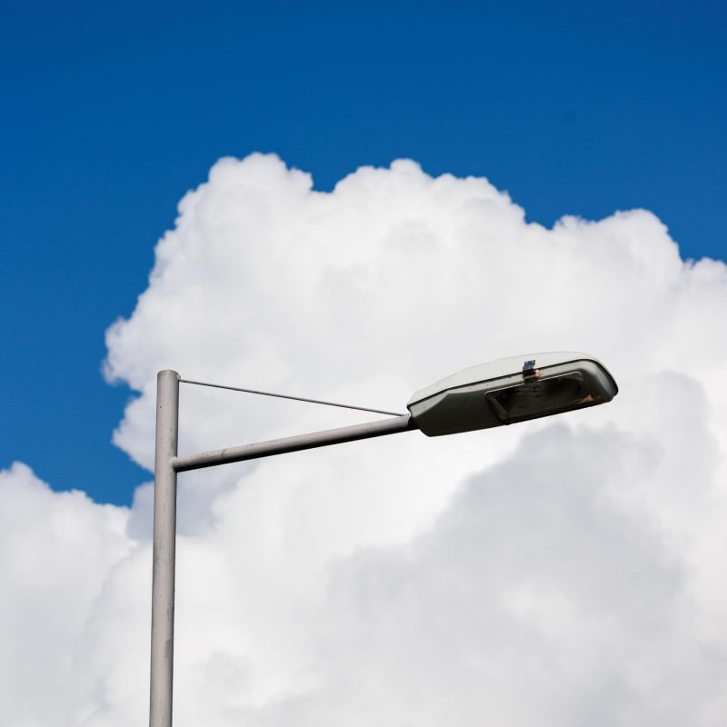 white cumulus clouds on blue sky street lamp, beautiful view of sky and storm clouds. Huge majestic cloud phenomena. nature atmosphere ecology weather. Storm warning, weather change before a storm